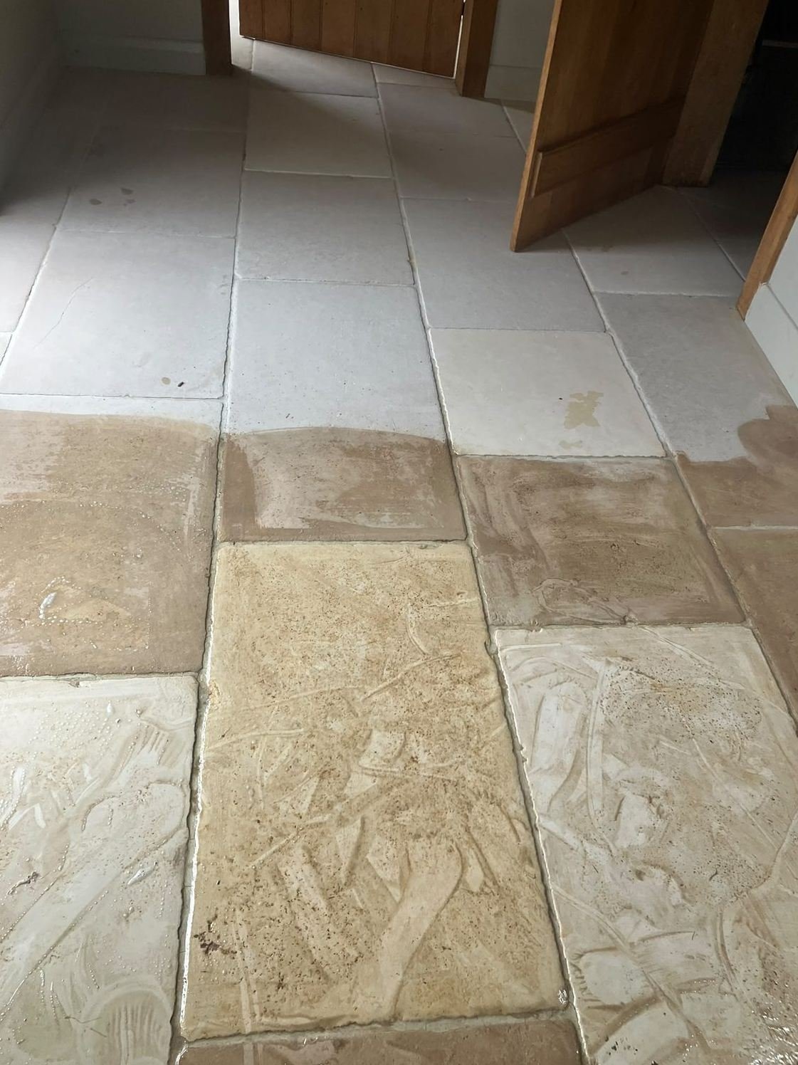 Flagstone floor part-way through a deep clean in a Leeds home
